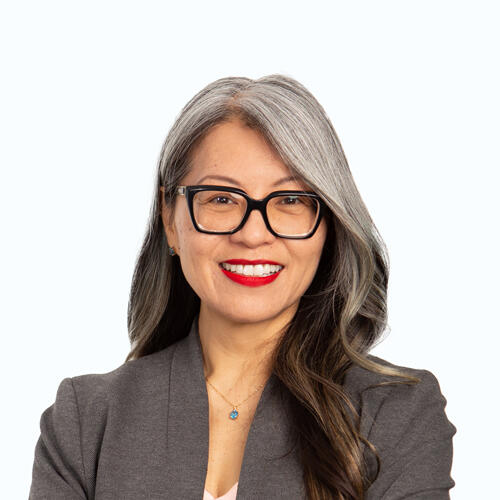 Leni headshot Leni smiling at the camera